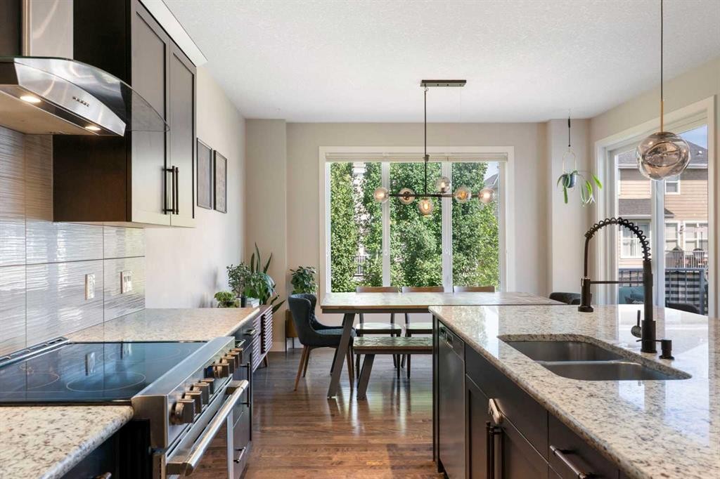 434 River Heights Drive, Cochrane, AB - Indoor Photo Showing Kitchen With Double Sink With Upgraded Kitchen
