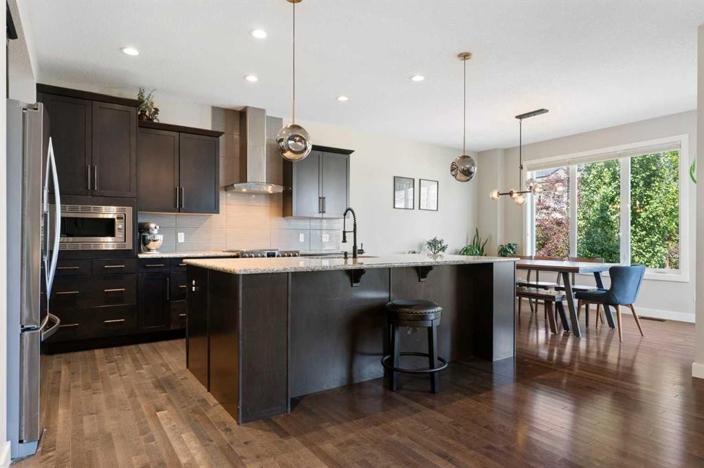 434 River Heights Drive, Cochrane, AB - Indoor Photo Showing Kitchen With Upgraded Kitchen