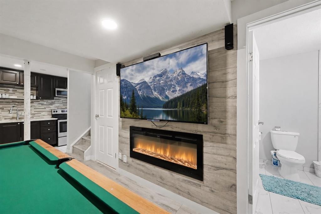 760 Saddlecreek Way Ne, Calgary, AB - Indoor With Fireplace