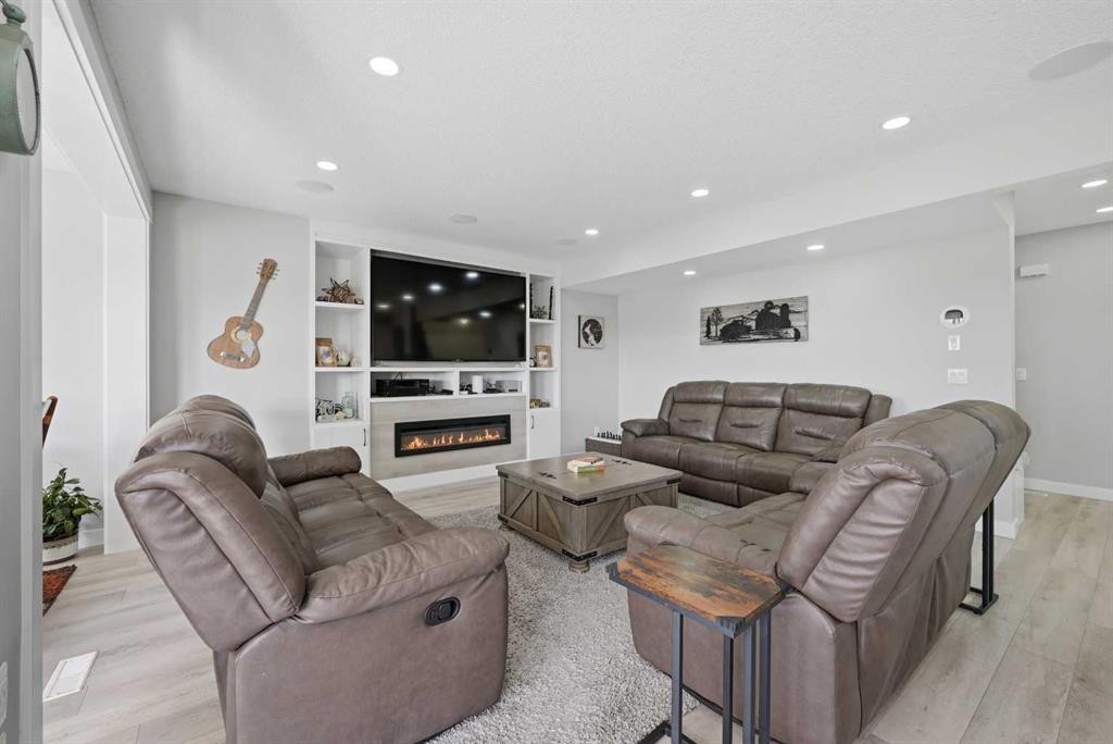 760 Saddlecreek Way Ne, Calgary, AB - Indoor Photo Showing Living Room With Fireplace