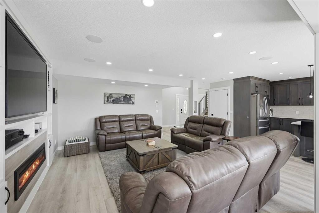 760 Saddlecreek Way Ne, Calgary, AB - Indoor Photo Showing Living Room With Fireplace