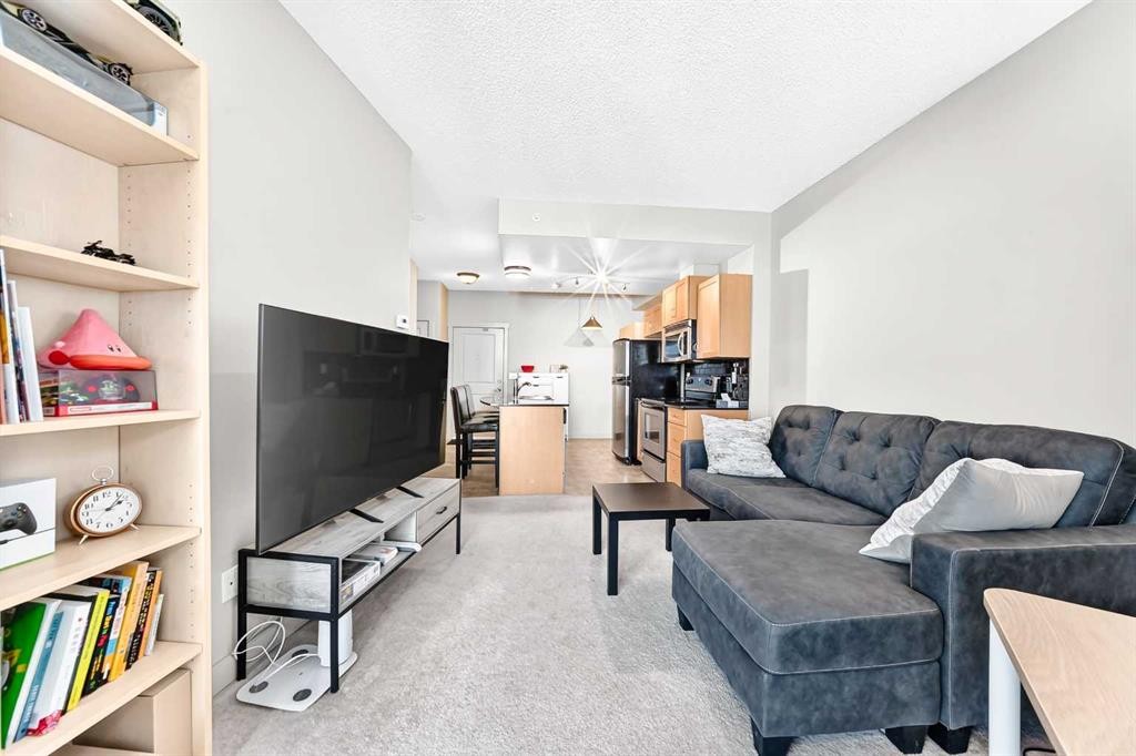 5601-11811 Lake Fraser Drive Se, Calgary, AB - Indoor Photo Showing Living Room
