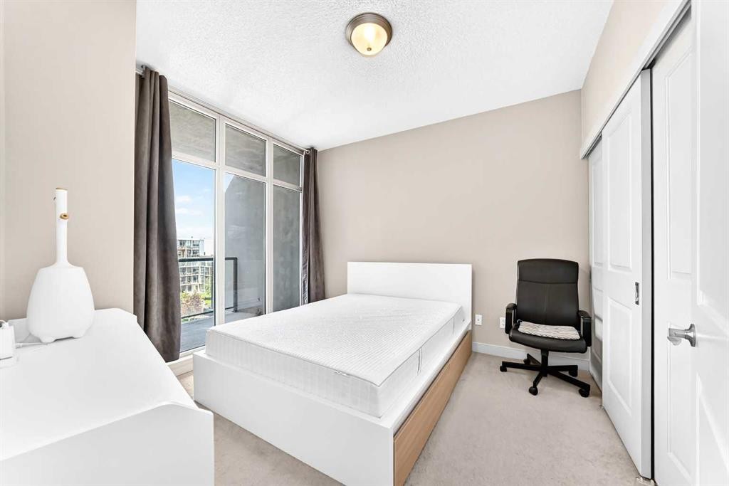 5601-11811 Lake Fraser Drive Se, Calgary, AB - Indoor Photo Showing Bedroom