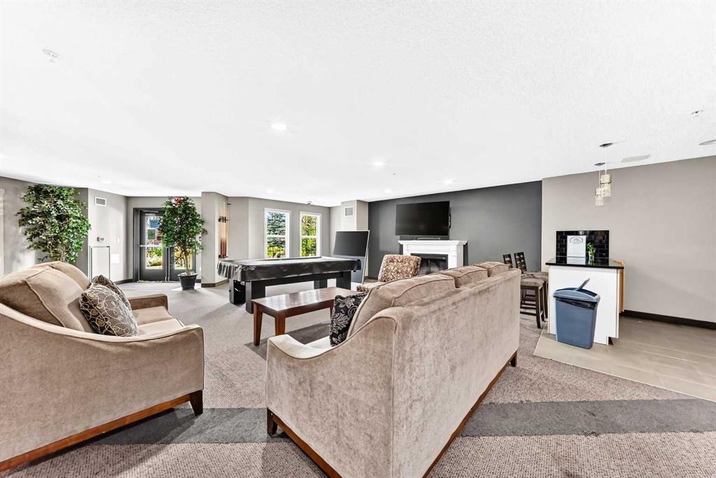 5601-11811 Lake Fraser Drive Se, Calgary, AB - Indoor With Fireplace