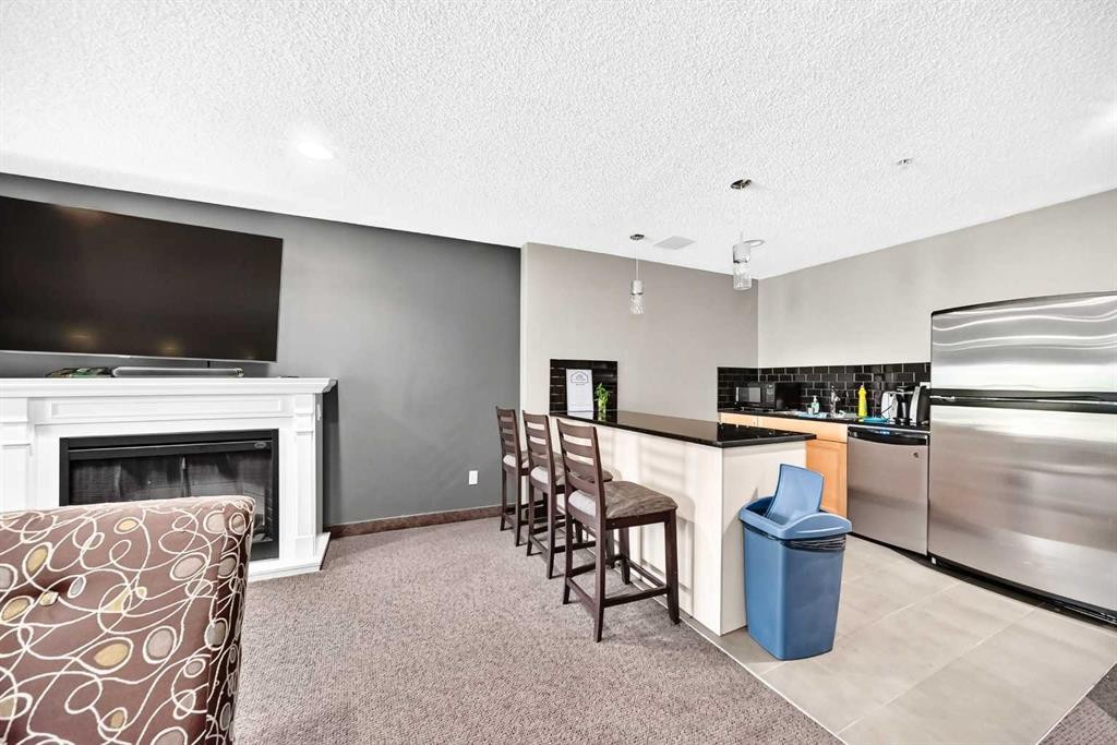 5601-11811 Lake Fraser Drive Se, Calgary, AB - Indoor With Fireplace