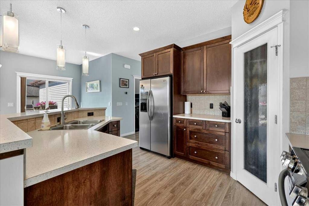 21 Mcintyre Place Nw, Langdon, AB - Indoor Photo Showing Kitchen With Double Sink