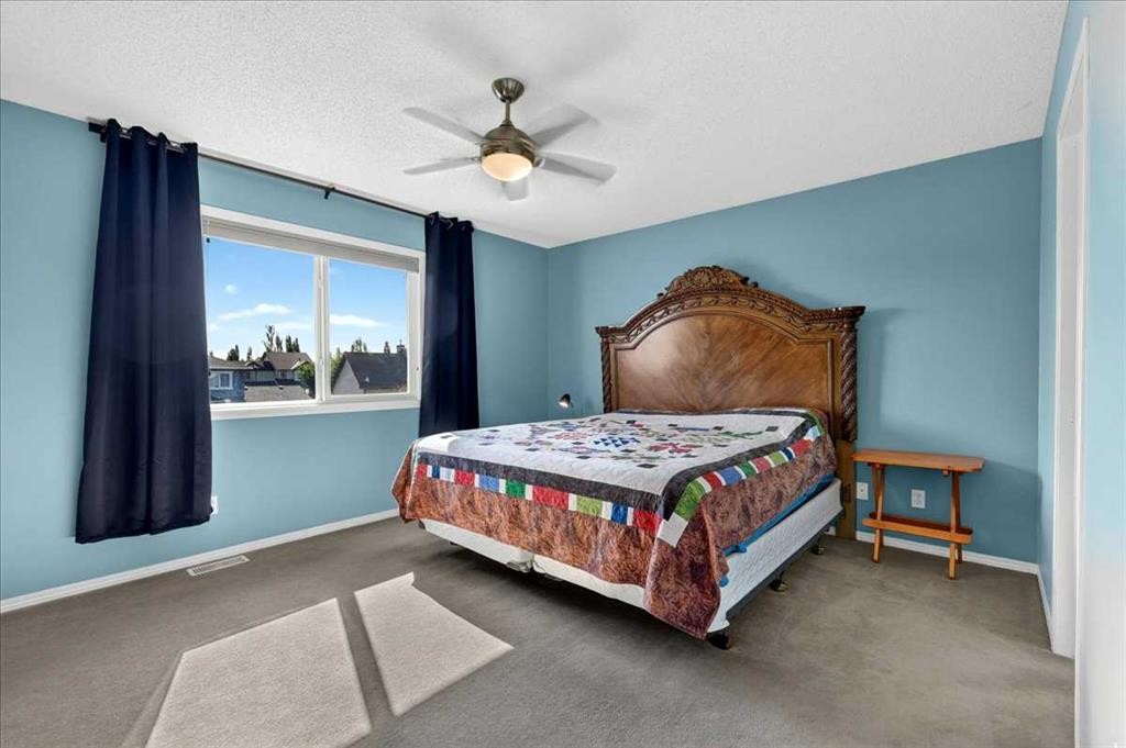 21 Mcintyre Place Nw, Langdon, AB - Indoor Photo Showing Bedroom