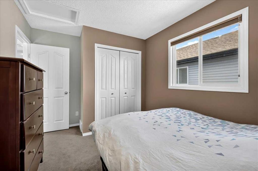 21 Mcintyre Place Nw, Langdon, AB - Indoor Photo Showing Bedroom