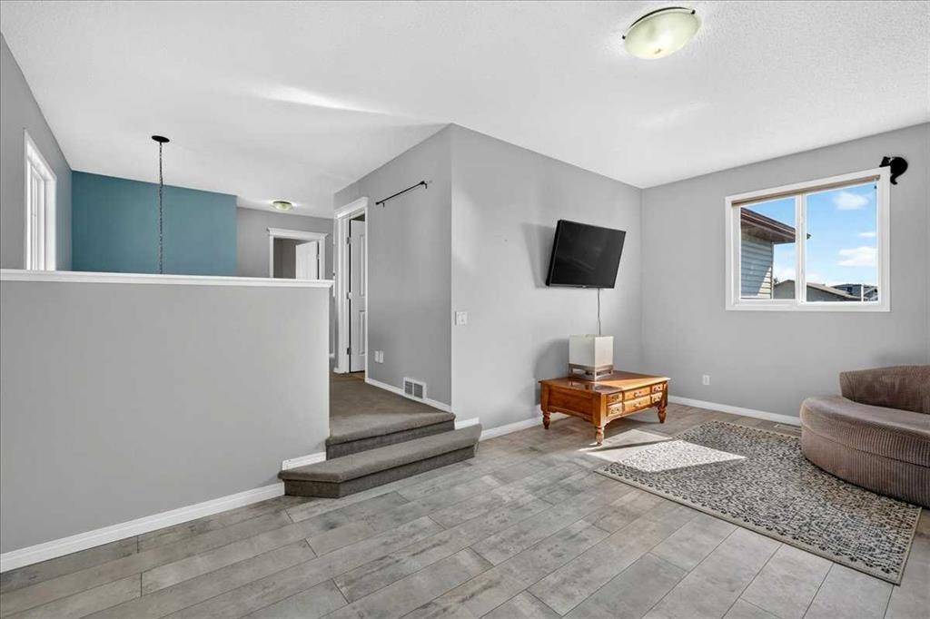 21 Mcintyre Place Nw, Langdon, AB - Indoor Photo Showing Other Room