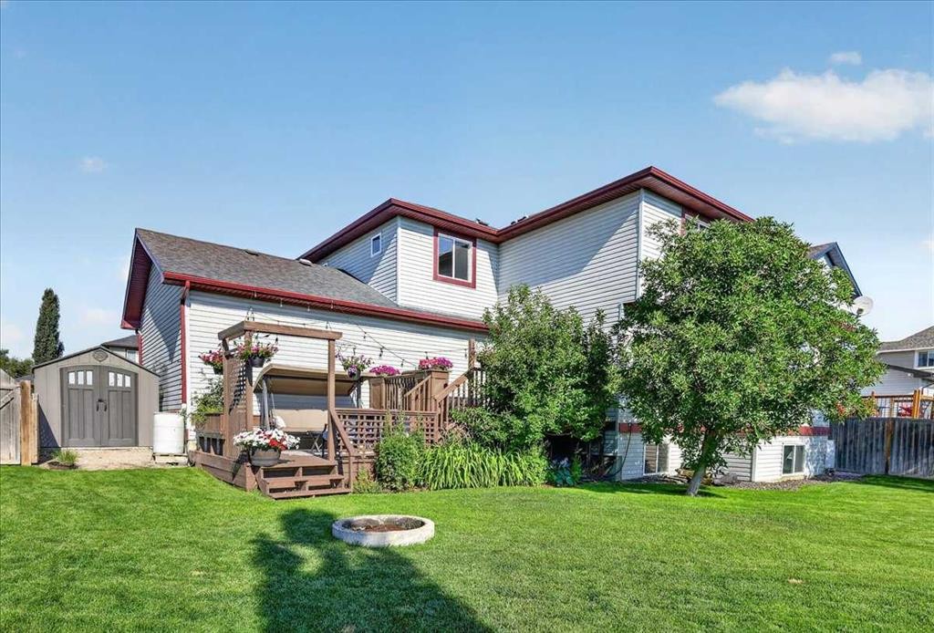 21 Mcintyre Place Nw, Langdon, AB - Outdoor With Deck Patio Veranda
