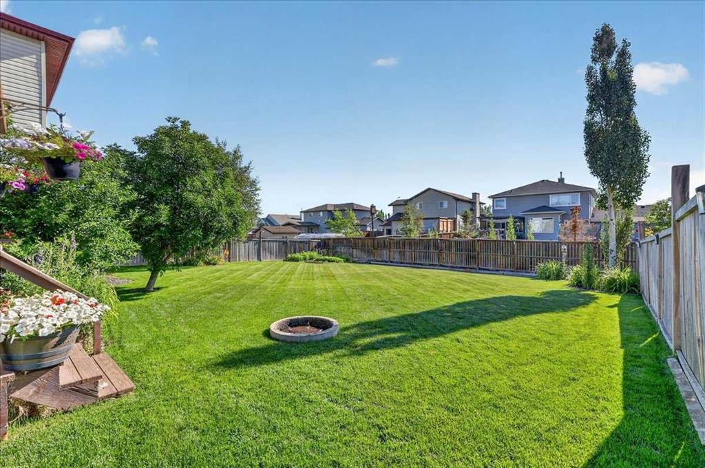 21 Mcintyre Place Nw, Langdon, AB - Outdoor With Backyard