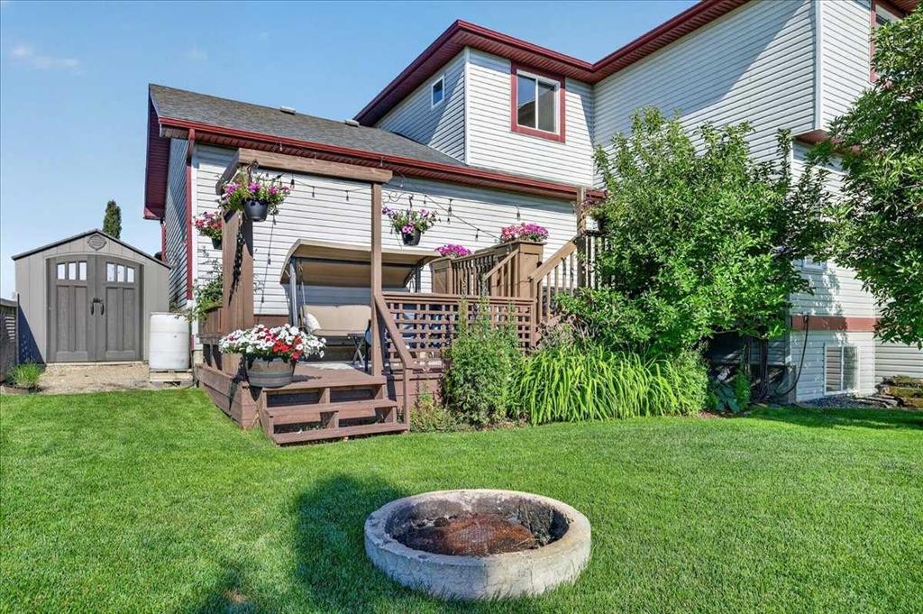 21 Mcintyre Place Nw, Langdon, AB - Outdoor With Deck Patio Veranda