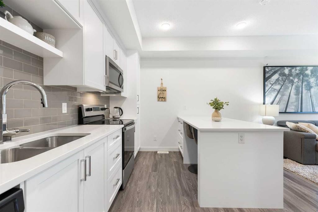 1307-100 Walgrove Court Se, Calgary, AB - Indoor Photo Showing Kitchen With Double Sink