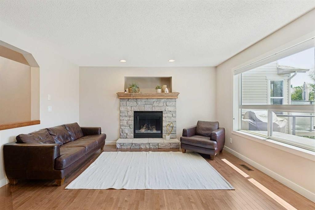 36 Cranwell Green Se, Calgary, AB - Indoor Photo Showing Living Room With Fireplace