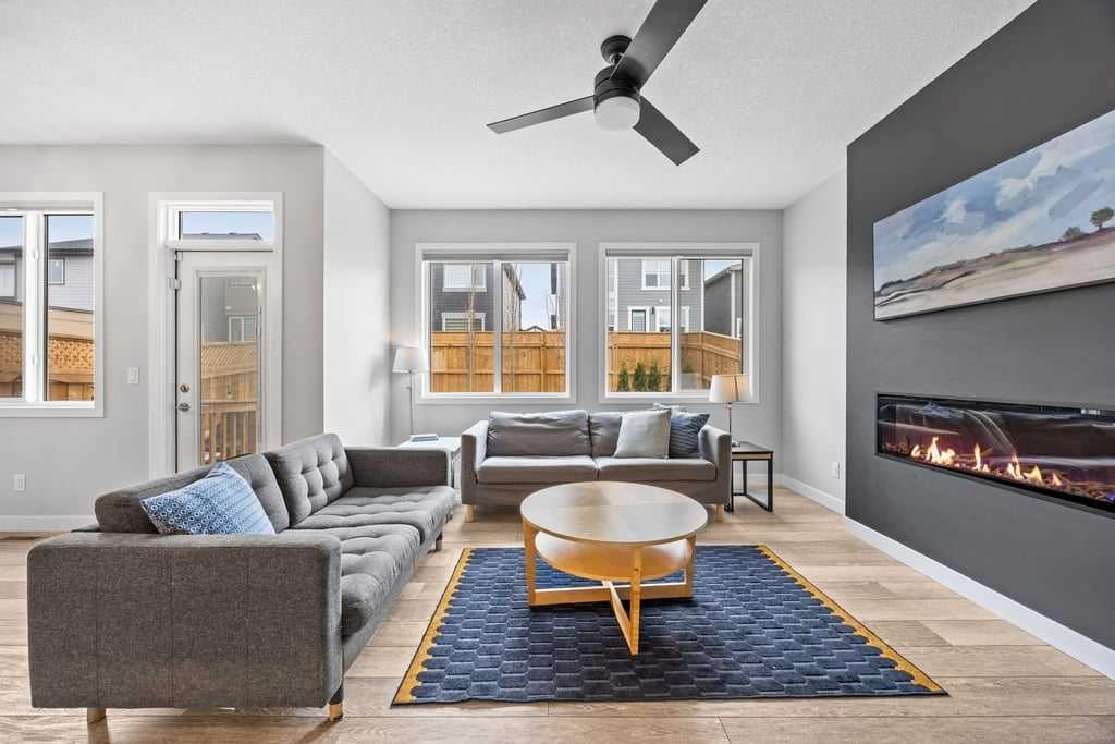 338 Magnolia Way Se, Calgary, AB - Indoor Photo Showing Living Room With Fireplace