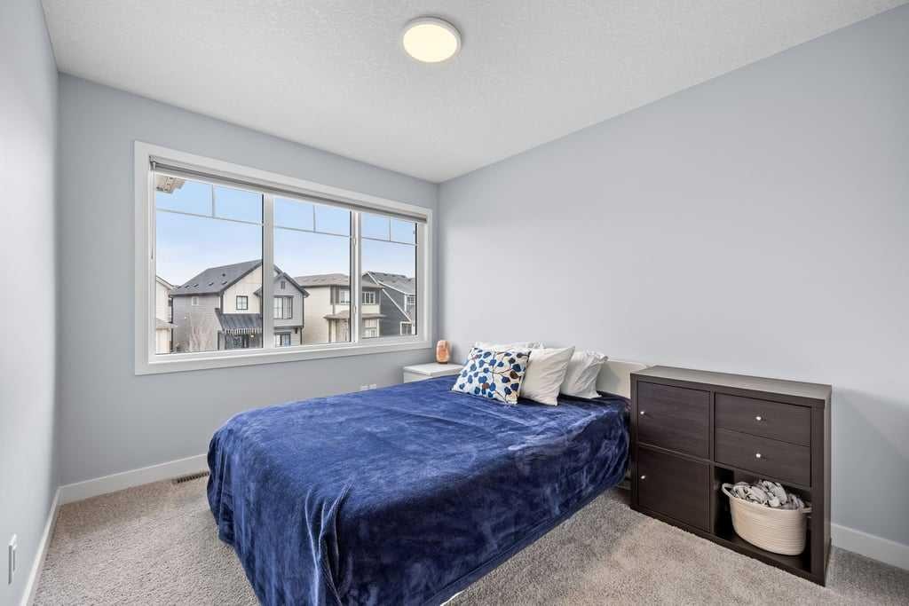338 Magnolia Way Se, Calgary, AB - Indoor Photo Showing Bedroom
