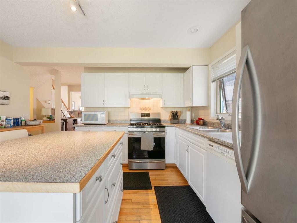 81 Prominence View Sw, Calgary, AB - Indoor Photo Showing Kitchen With Double Sink