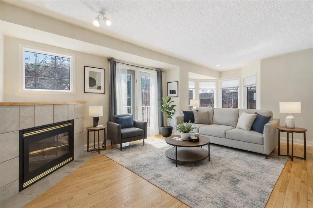 81 Prominence View Sw, Calgary, AB - Indoor Photo Showing Living Room With Fireplace
