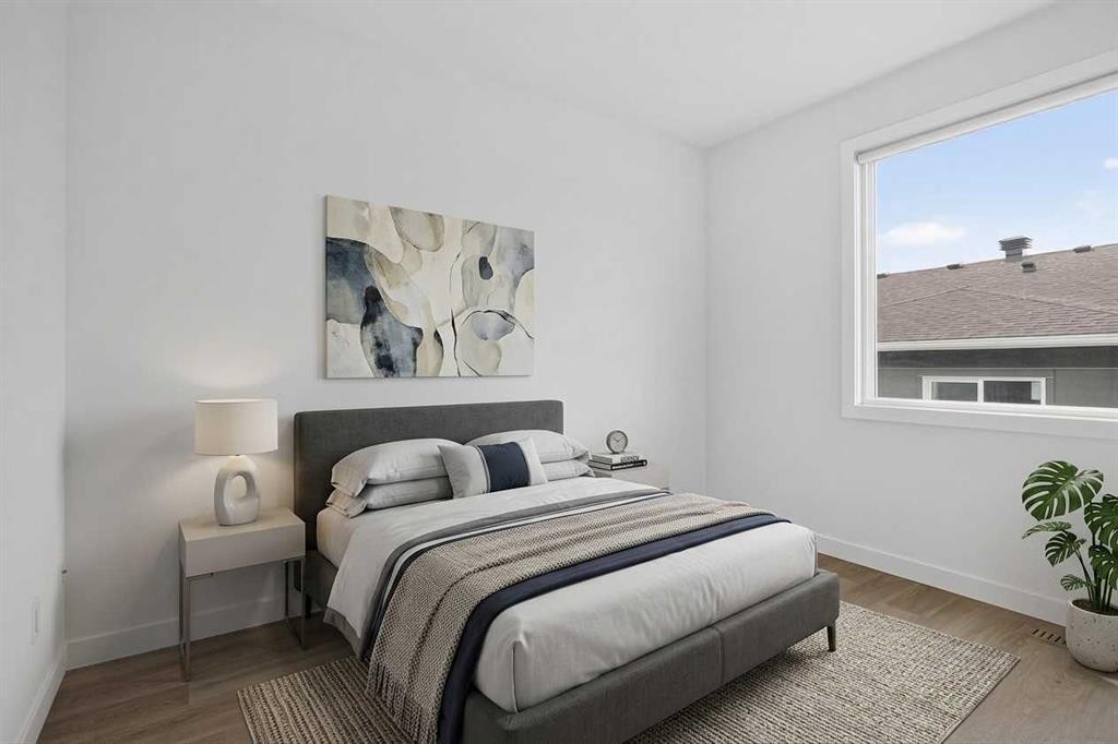 202-101 Panatella Square Nw, Calgary, AB - Indoor Photo Showing Bedroom