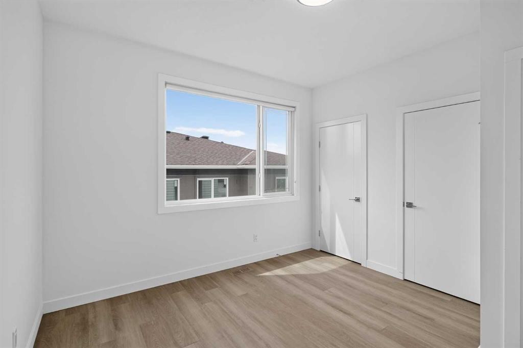 202-101 Panatella Square Nw, Calgary, AB - Indoor Photo Showing Other Room