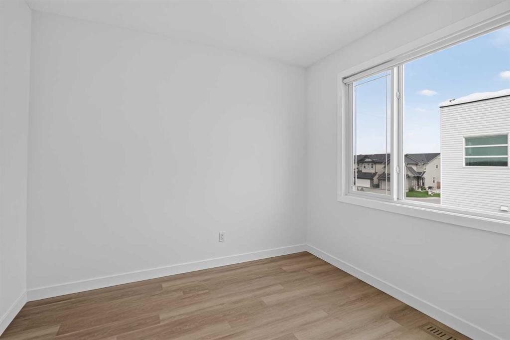 202-101 Panatella Square Nw, Calgary, AB - Indoor Photo Showing Other Room