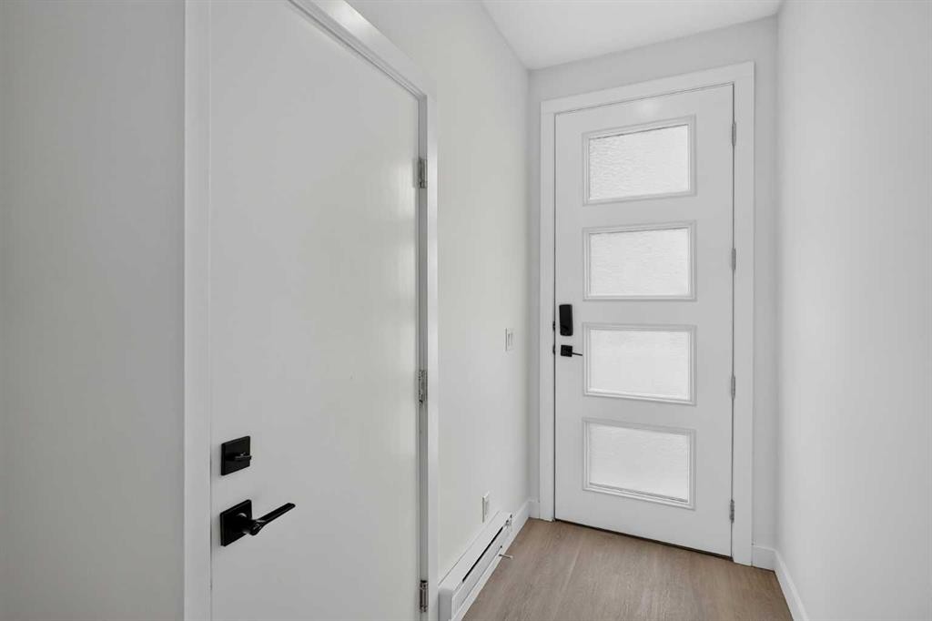 202-101 Panatella Square Nw, Calgary, AB - Indoor Photo Showing Other Room