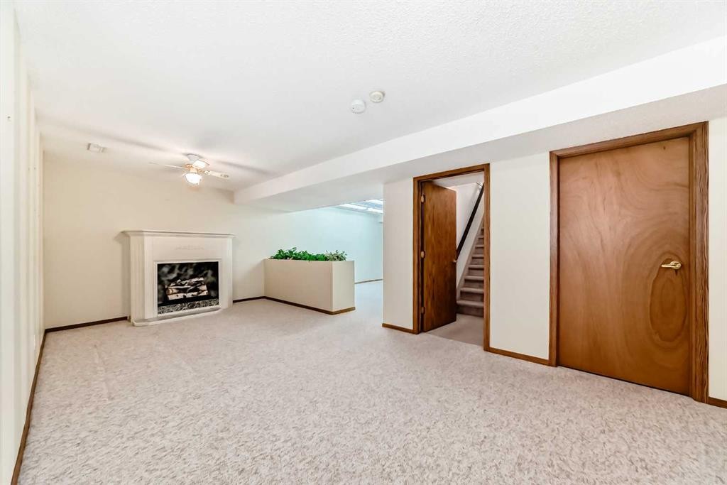 16 Edenwold Green Nw, Calgary, AB - Indoor With Fireplace