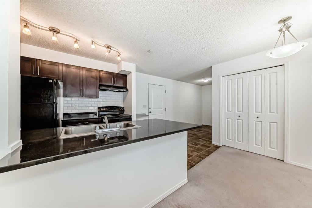 111-195 Kincora Glen Road Nw, Calgary, AB - Indoor Photo Showing Kitchen With Double Sink