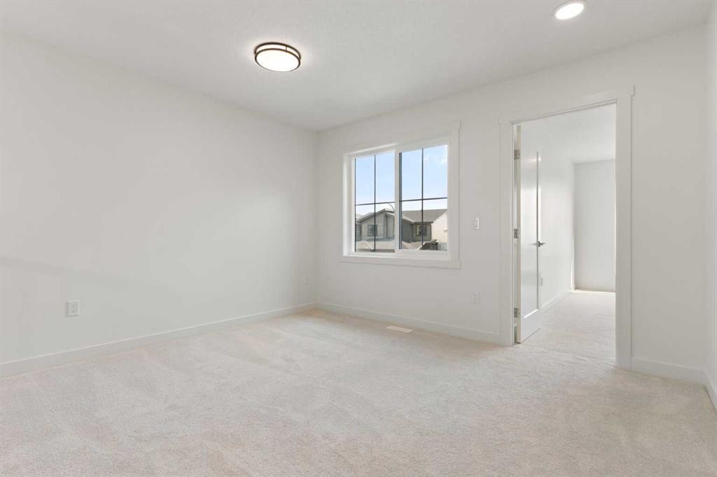 91 Heritage Manor, Cochrane, AB - Indoor Photo Showing Other Room
