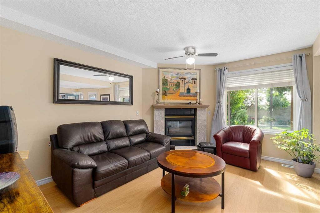 232 Harvest Glen Place Ne, Calgary, AB - Indoor Photo Showing Living Room With Fireplace