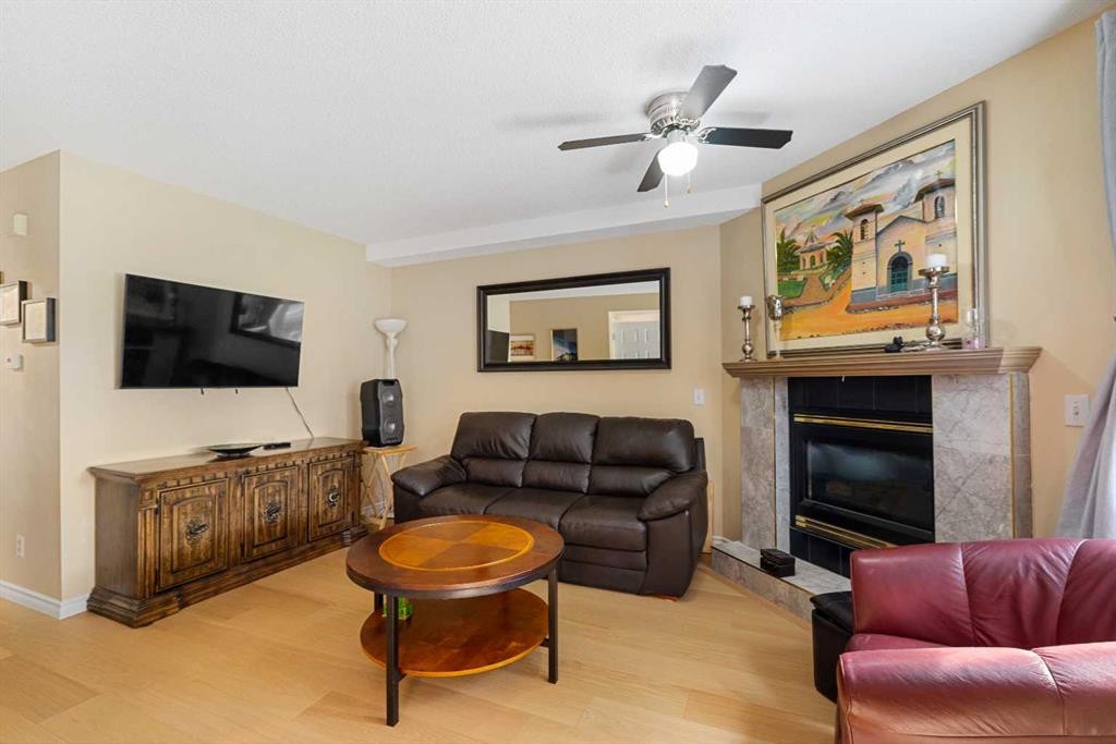 232 Harvest Glen Place Ne, Calgary, AB - Indoor Photo Showing Living Room With Fireplace