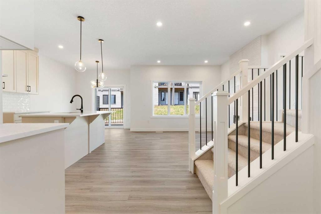 83 Heritage Manor, Cochrane, AB - Indoor Photo Showing Kitchen With Upgraded Kitchen