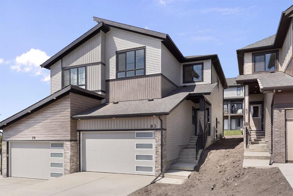 83 Heritage Manor, Cochrane, AB - Outdoor With Facade
