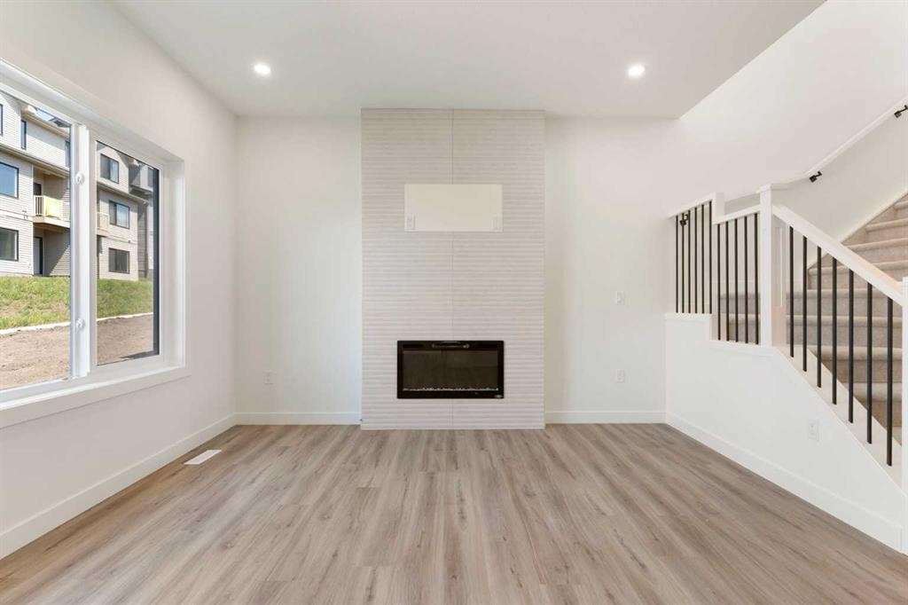 83 Heritage Manor, Cochrane, AB - Indoor Photo Showing Other Room