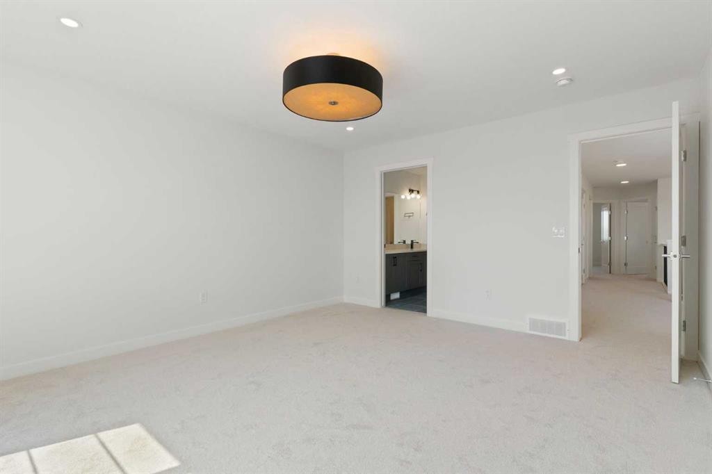 83 Heritage Manor, Cochrane, AB - Indoor Photo Showing Other Room