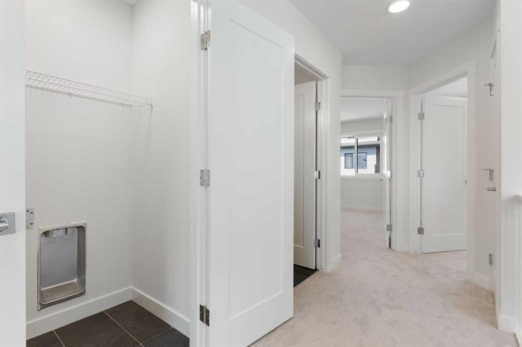 83 Heritage Manor, Cochrane, AB - Indoor Photo Showing Other Room