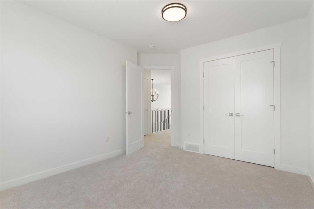 83 Heritage Manor, Cochrane, AB - Indoor Photo Showing Other Room