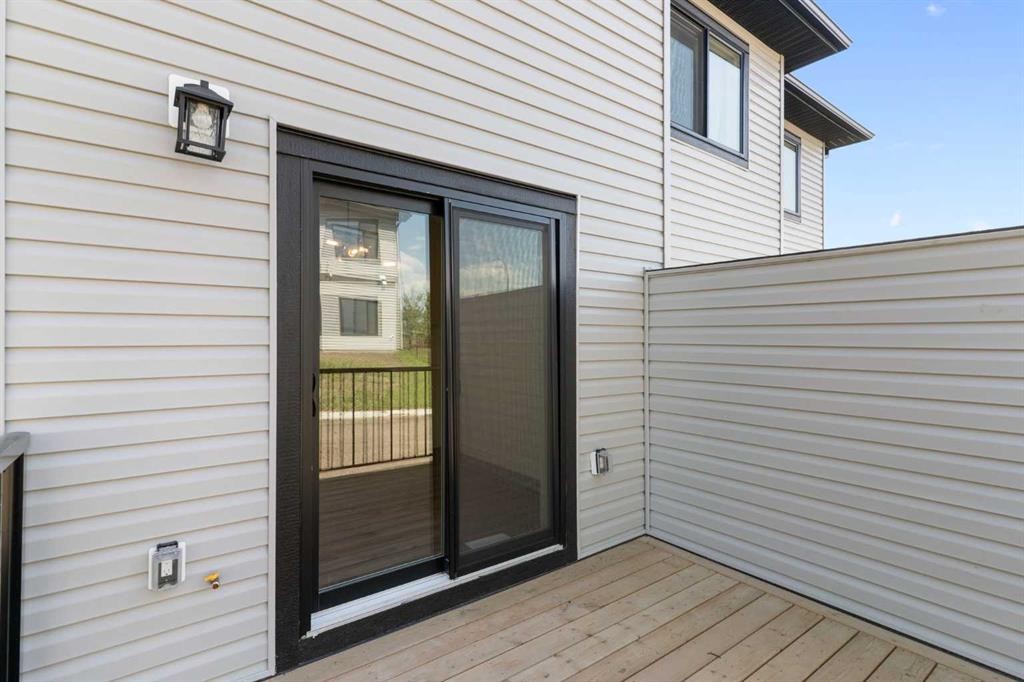 83 Heritage Manor, Cochrane, AB - Outdoor With Exterior