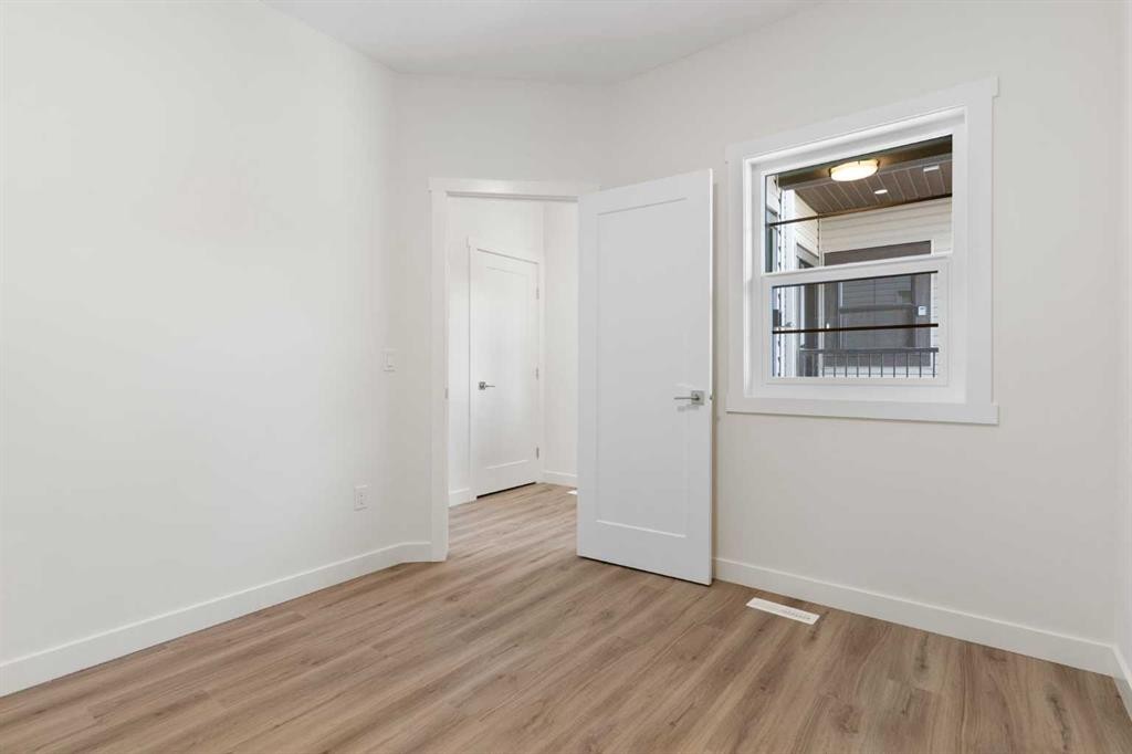 83 Heritage Manor, Cochrane, AB - Indoor Photo Showing Other Room