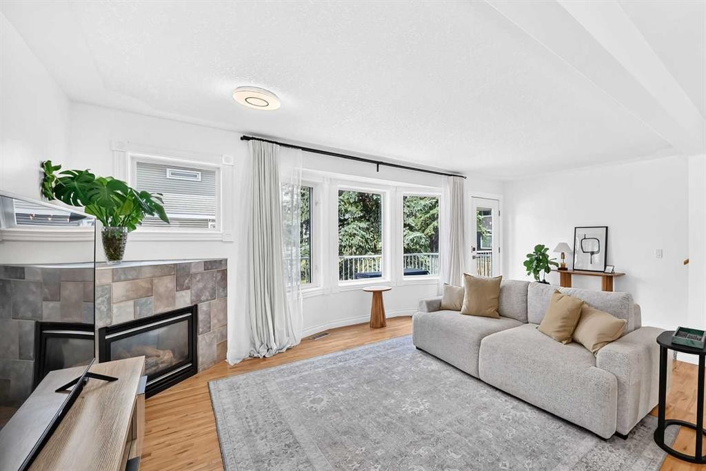 357 Regal Park Ne, Calgary, AB - Indoor Photo Showing Living Room With Fireplace