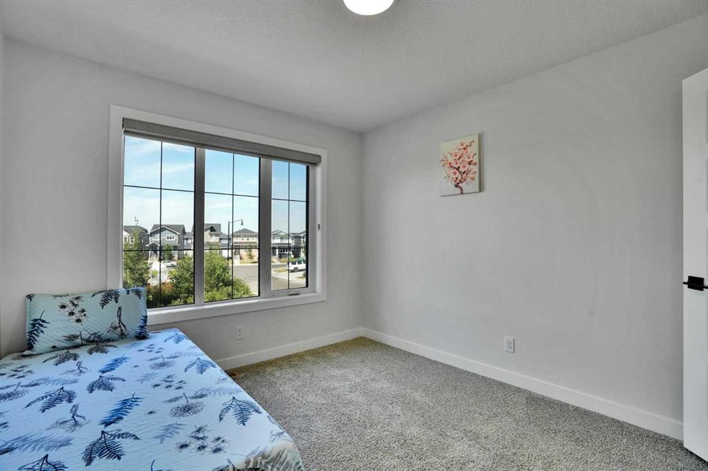 45 Dawson Gardens, Chestermere, AB - Indoor Photo Showing Bedroom