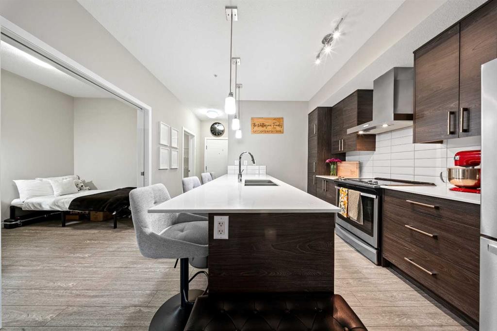 105-2231 Mahogany Boulevard Se, Calgary, AB - Indoor Photo Showing Kitchen With Upgraded Kitchen