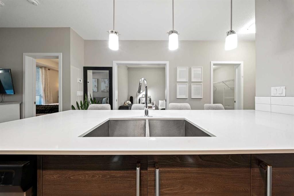 105-2231 Mahogany Boulevard Se, Calgary, AB - Indoor Photo Showing Kitchen With Double Sink