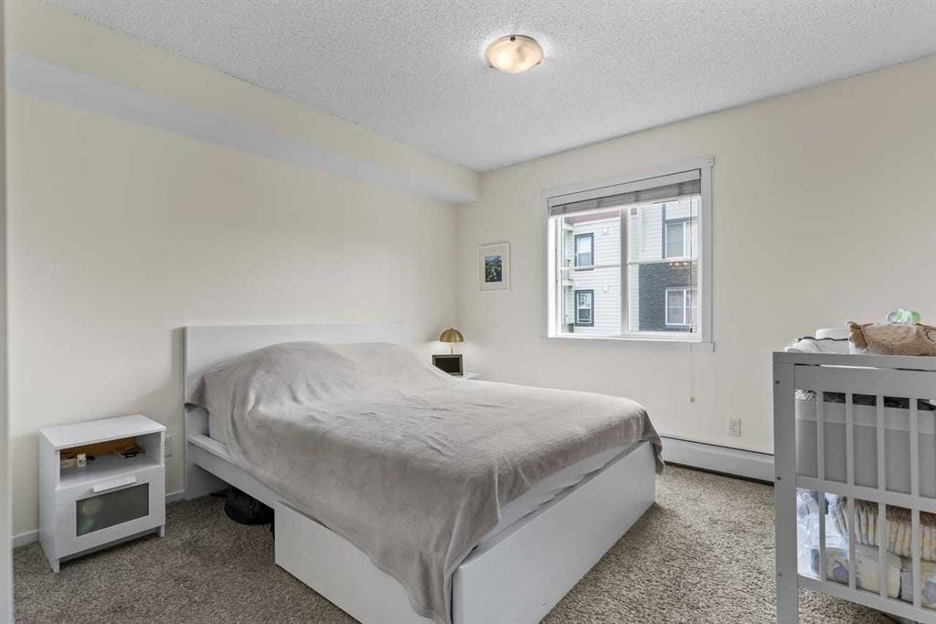 2201-81 Legacy Boulevard Se, Calgary, AB - Indoor Photo Showing Bedroom