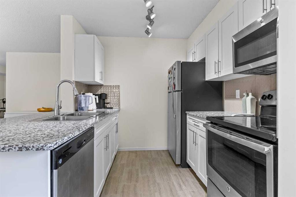 2201-81 Legacy Boulevard Se, Calgary, AB - Indoor Photo Showing Kitchen With Stainless Steel Kitchen With Double Sink
