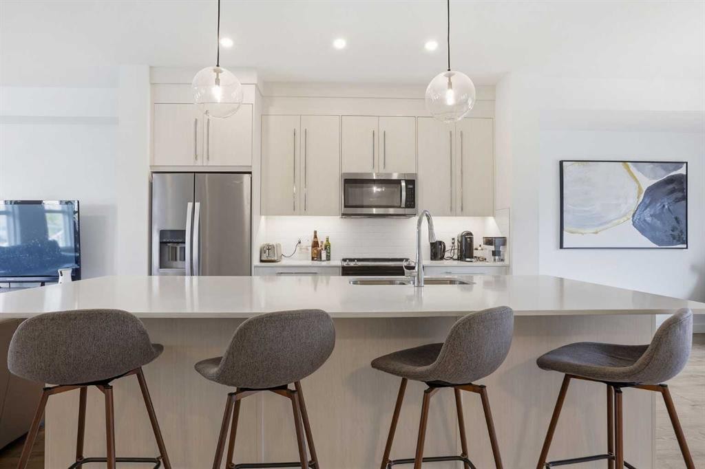 154 Merganser Drive West, Chestermere, AB - Indoor Photo Showing Kitchen With Stainless Steel Kitchen With Upgraded Kitchen