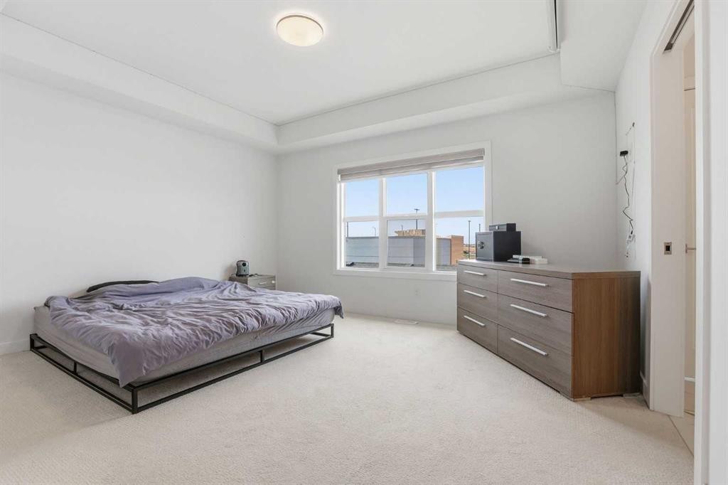 154 Merganser Drive West, Chestermere, AB - Indoor Photo Showing Bedroom