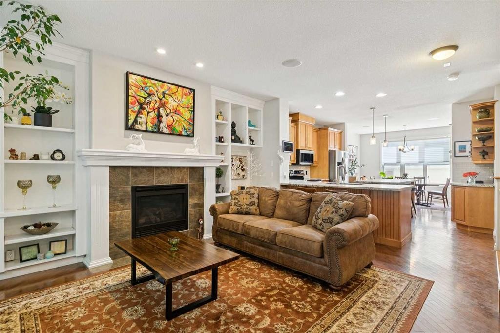 4008 Garrison Boulevard Sw, Calgary, AB - Indoor Photo Showing Living Room With Fireplace