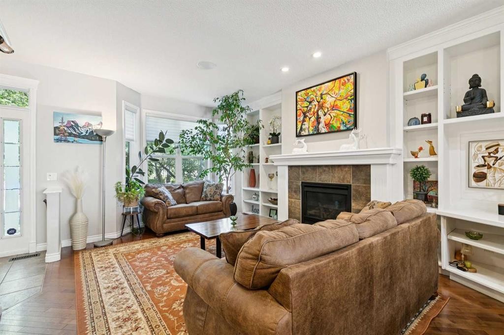4008 Garrison Boulevard Sw, Calgary, AB - Indoor Photo Showing Living Room With Fireplace
