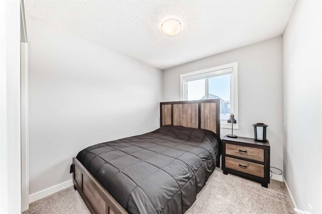 20893 Main Street Se, Calgary, AB - Indoor Photo Showing Bedroom